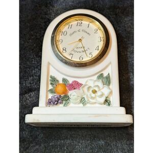 Hearts and flowers. Small ceramic clock and good working condition.